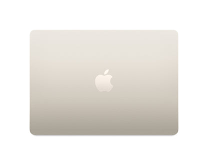 starlight macbook on a white background